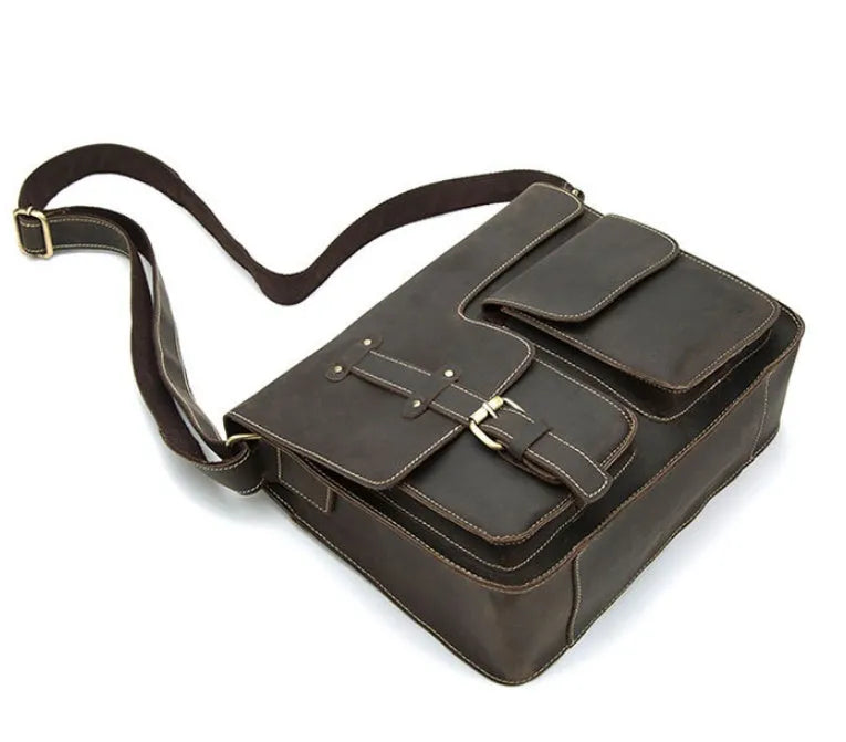 Brown leather vintage messenger bag with adjustable strap and buckle closure