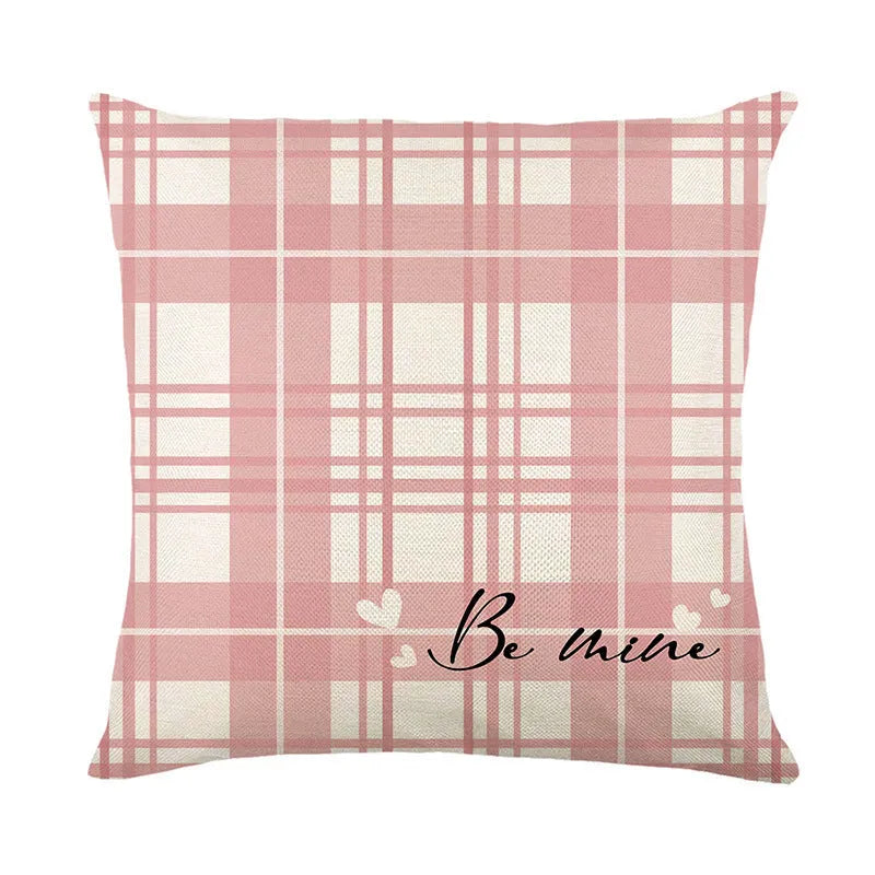 Red and white plaid heart print on a square pillow cover for Valentine's Day decoration.