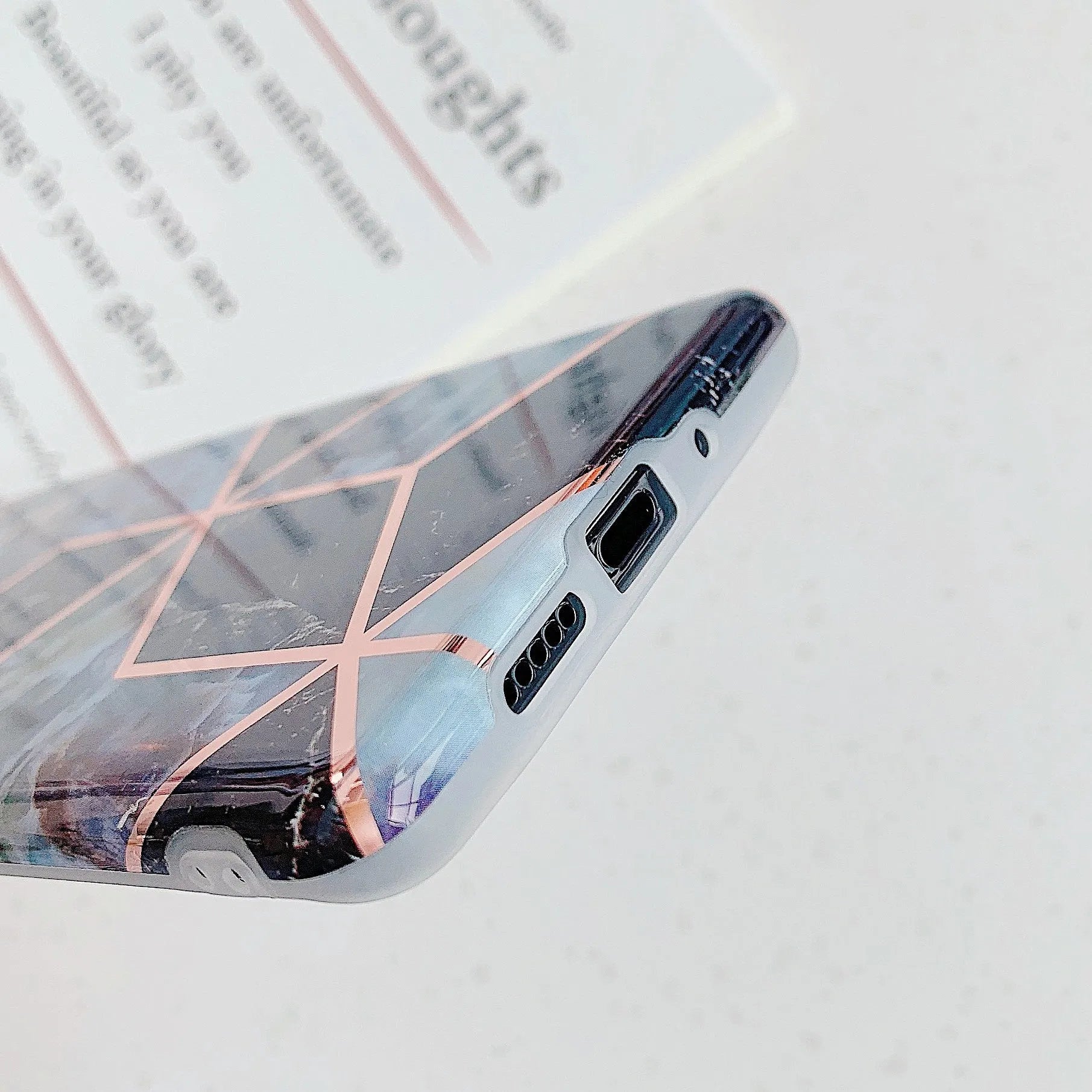 Glossy electroplated marble design TPU back cover case for a Huawei smartphone.