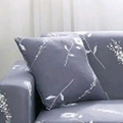 Printed stretch sofa cover with geometric pattern on three-seater sofa