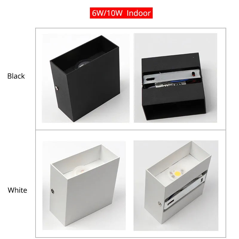 Compact black aluminium cube LED wall lamp mounted on a white wall.