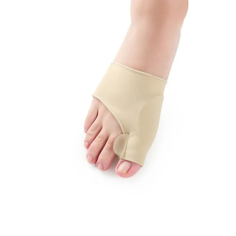 Corrective toe socks with silicone gel bunion pad and toe separator on a foot.