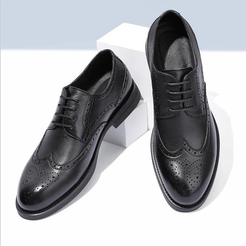 Men's black brogue leather shoes with traditional perforated detailing and lace-up design