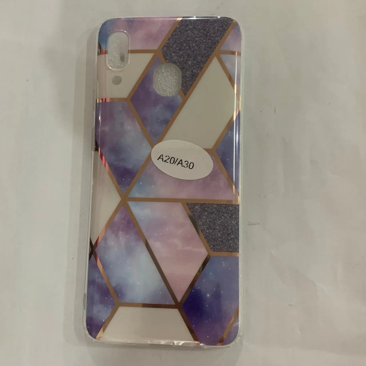 Glossy electroplated marble design TPU back cover case for a Huawei smartphone.