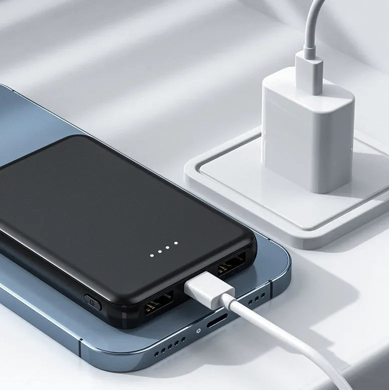 Black and white universal USB power bank for heated vests, showing compact size