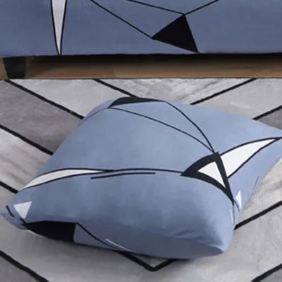 Printed stretch sofa cover with geometric pattern on three-seater sofa
