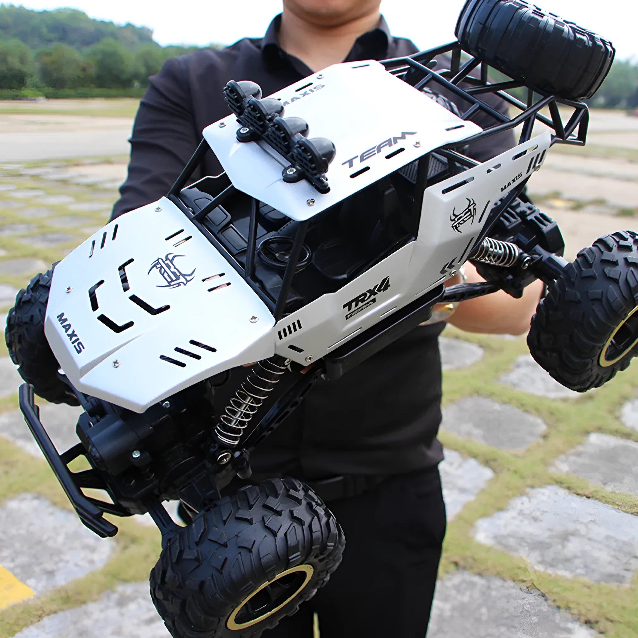 Large 4WD remote control climbing car with 2.4G wireless remote on off-road terrain