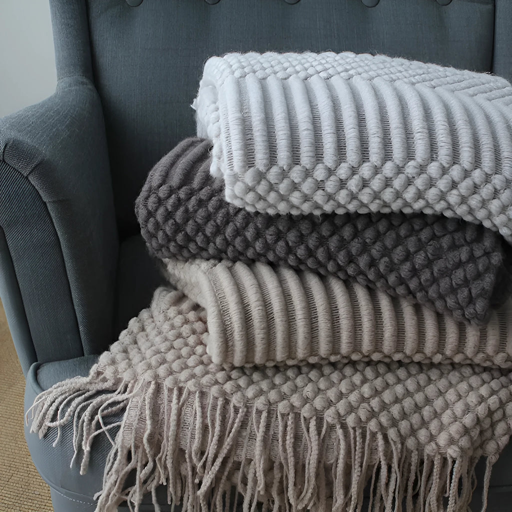 Small polyester fibre nap blanket measuring 127cm by 170cm in dark grey colour