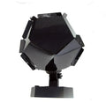 LED star projector night light showing constellation projection on a bedroom ceiling