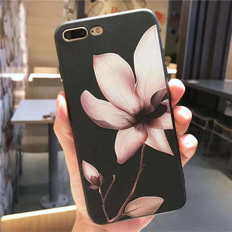 Embossed single flower design on black TPU iPhone case showing back cover protection
