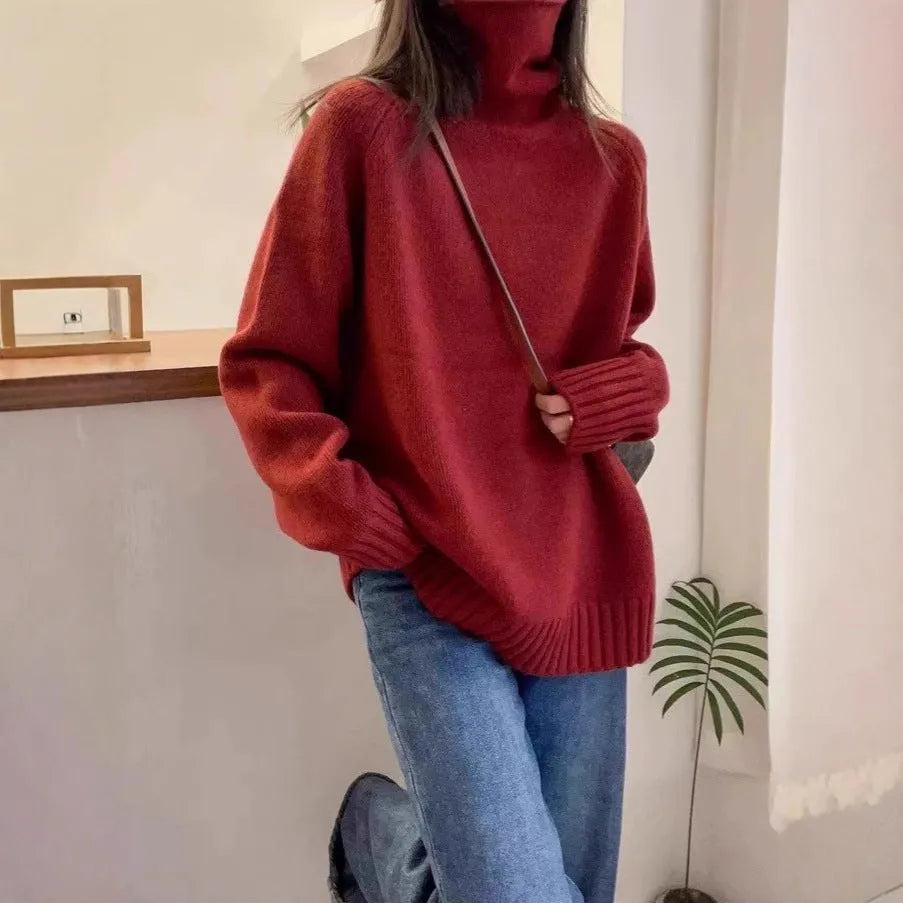 Women's loose-fit turtleneck sweater with thick curling pile collar in black, camel, grey, or red.