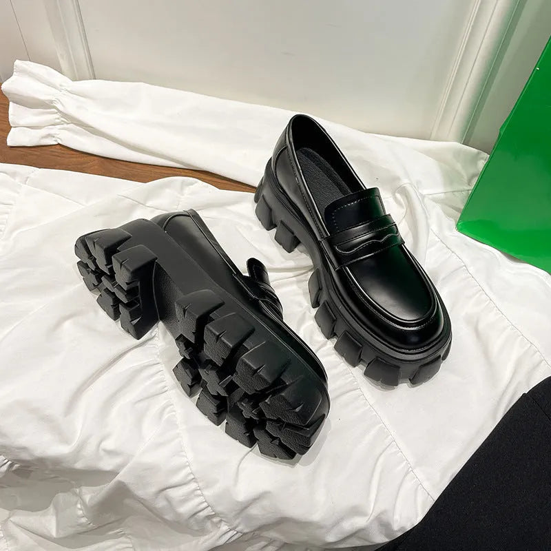 British style wide fit loafers in patent or matte leather with a rubber sole.