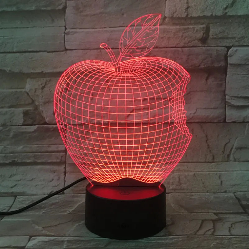 Colourful 3D fruit shaped night light with touch control on a table.