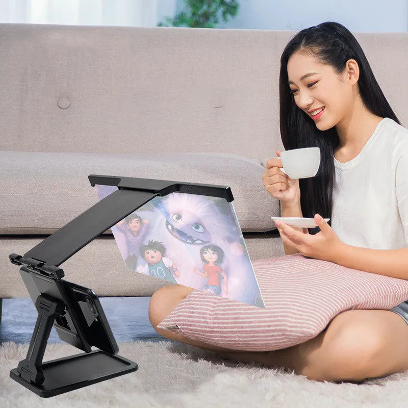 Black L20 split-screen mobile phone magnifier and separate phone bracket on a table.