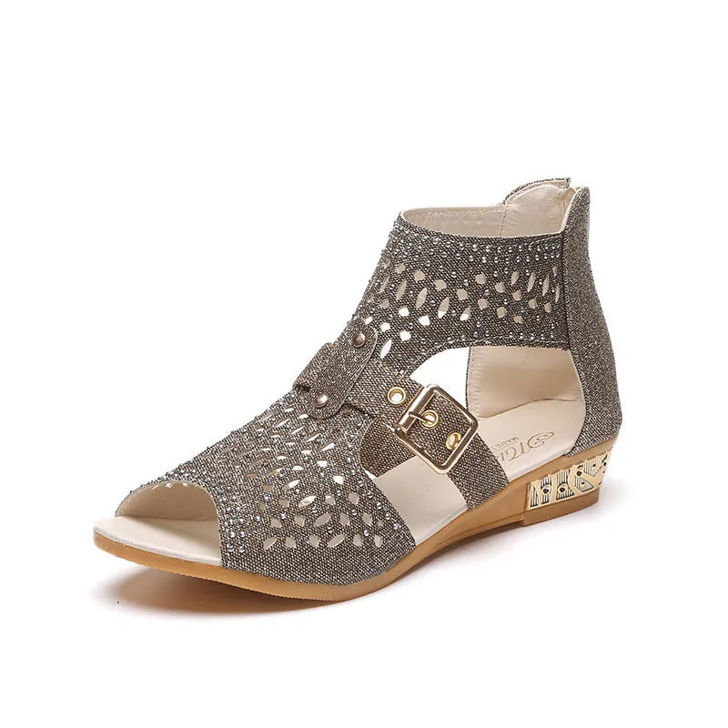 Women's beige rivet flat sandals with a back zipper, fish mouth toe, and a low wedge heel.