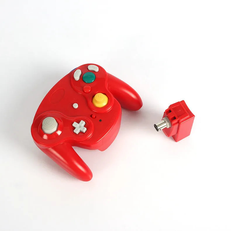 NGC 2.4G wireless game controller for Wii and GameCube consoles in various colours on a white background.