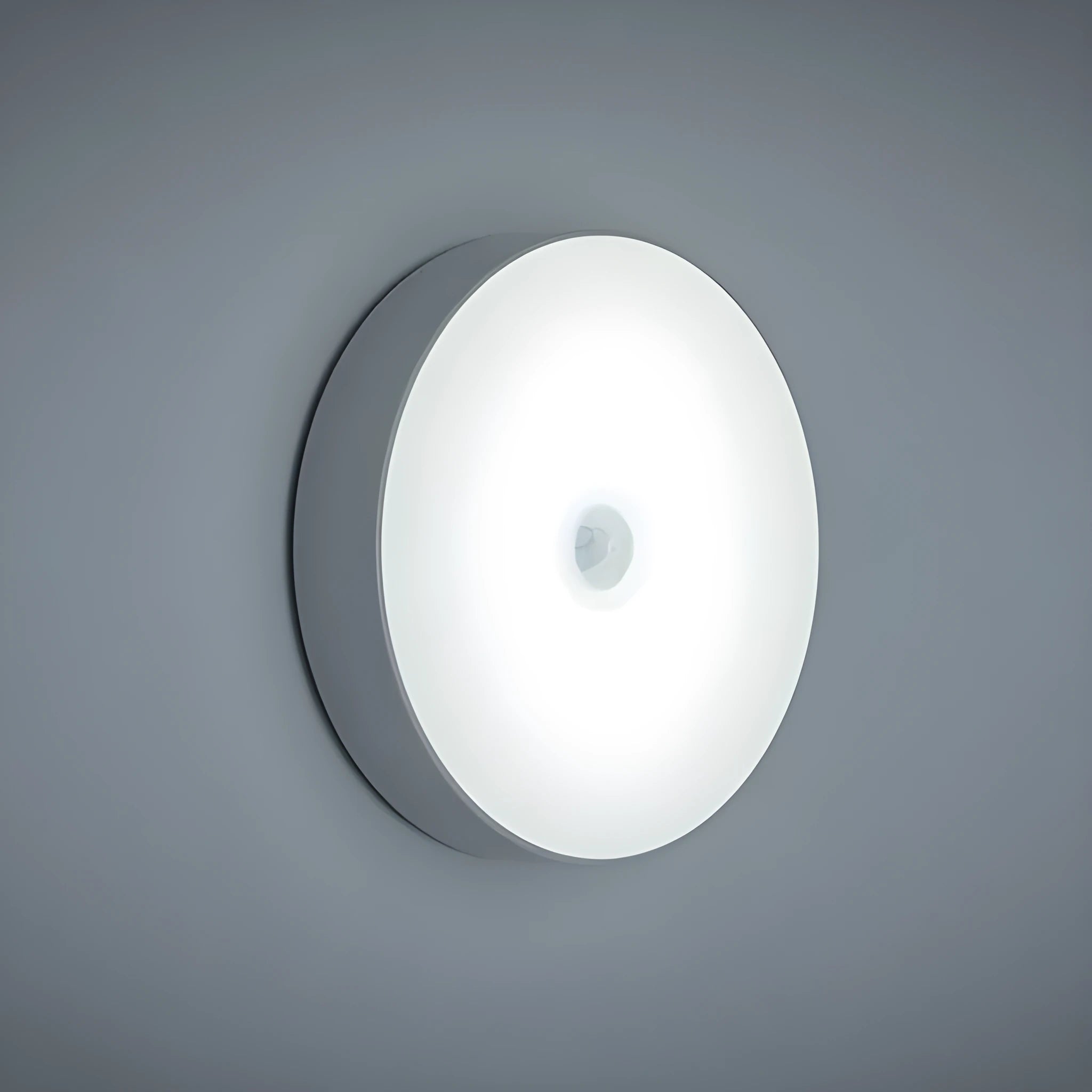 Small white USB rechargeable motion sensor LED night light with adhesive backing