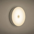 Small white USB rechargeable motion sensor LED night light with adhesive backing