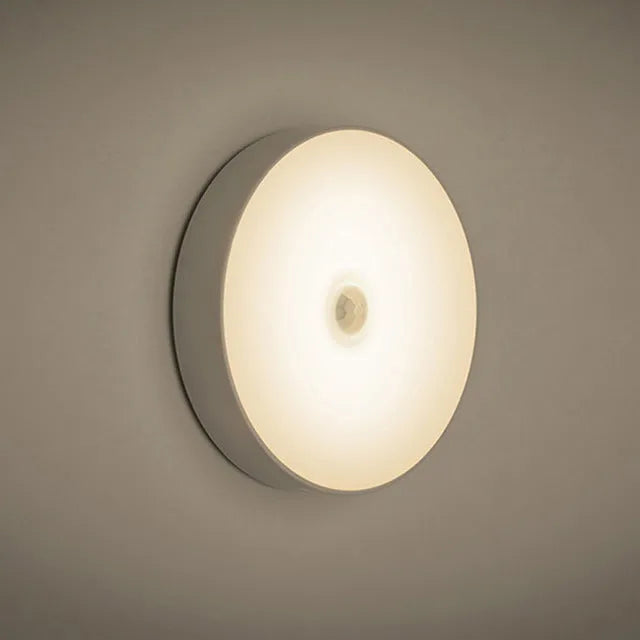 Small white USB rechargeable motion sensor LED night light with adhesive backing