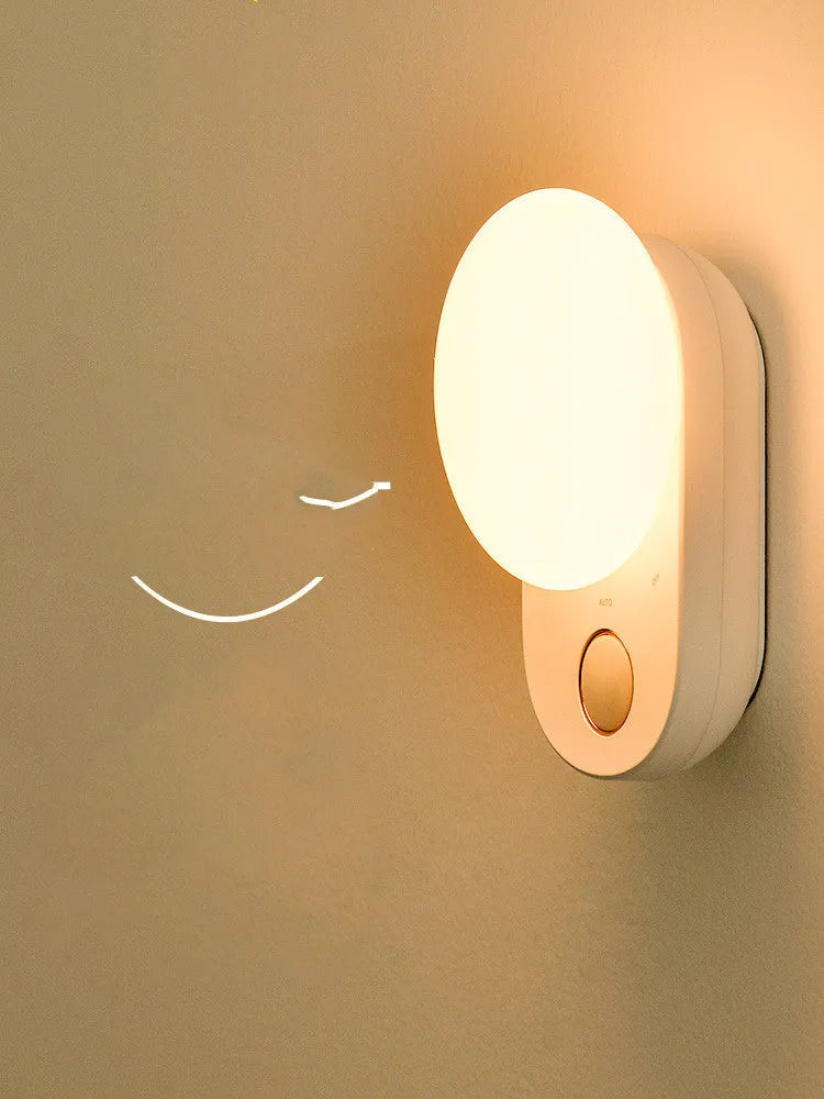 White Baseus rechargeable sensor night light with motion detection and warm LED glow.