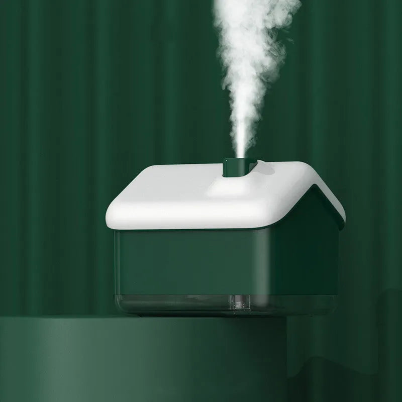 White ultrasonic humidifier and essential oil diffuser with LED light showing mist output
