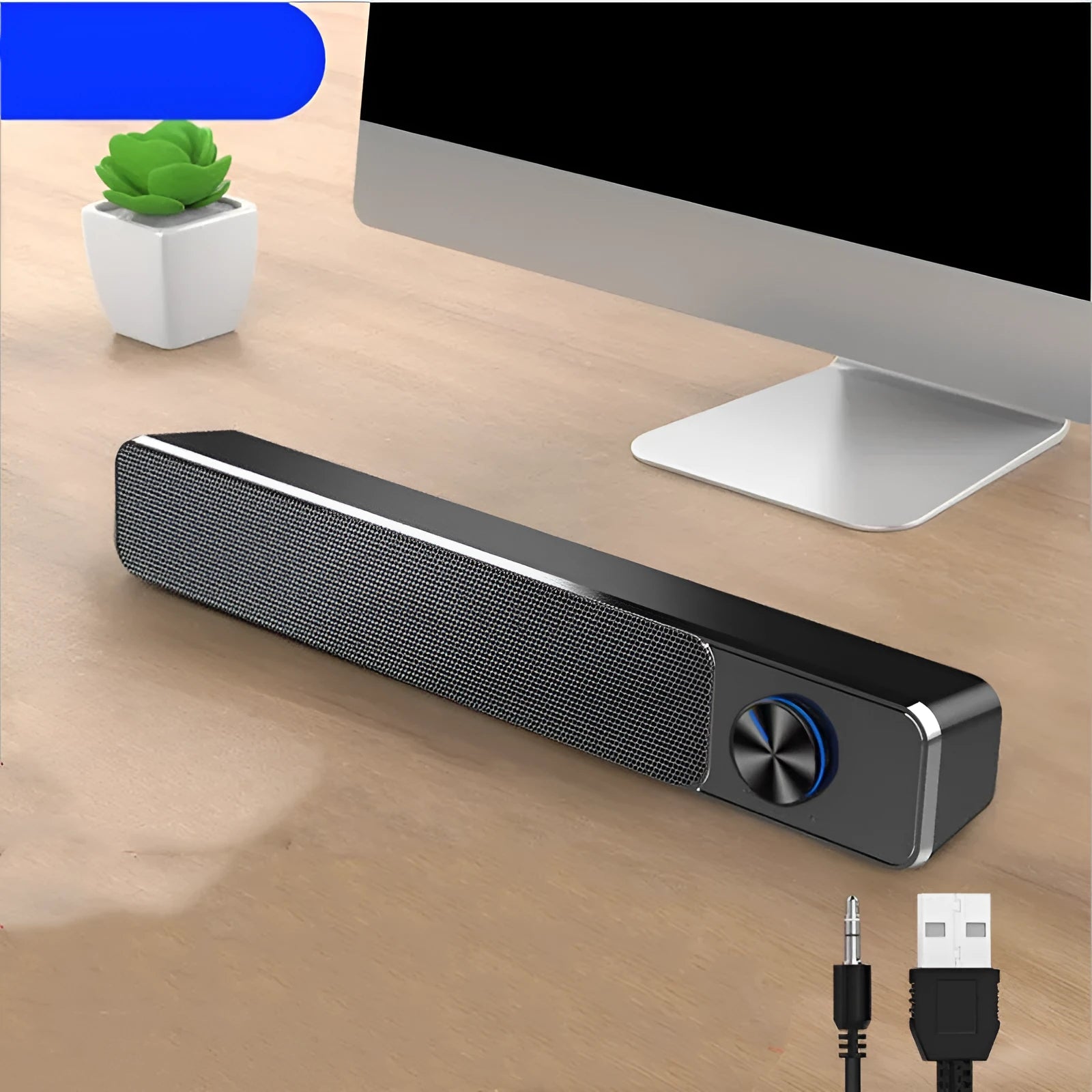 Black and white desktop computer speaker with 2.0 channel audio on wooden desk