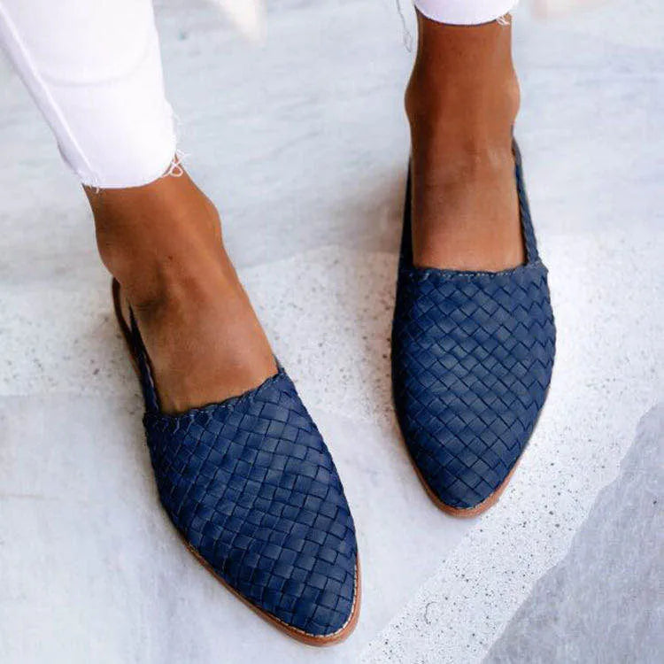 Baotou flat sandals with a buckle strap and pointed toe, shown in one of six available colours.