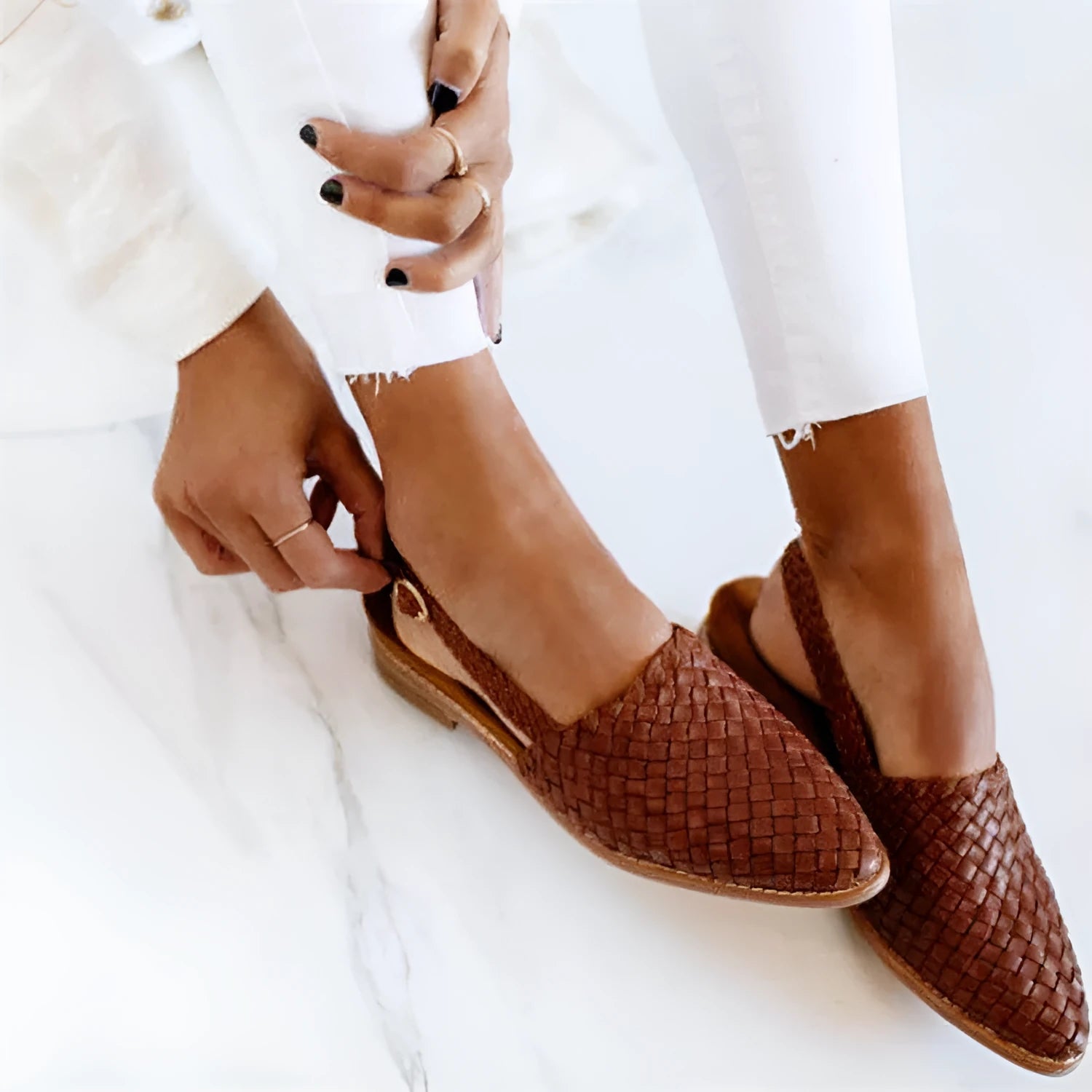 Baotou flat sandals with a buckle strap and pointed toe, shown in one of six available colours.