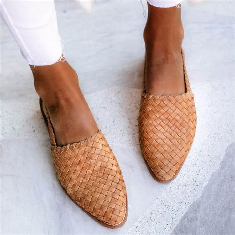 Baotou flat sandals with a buckle strap and pointed toe, shown in one of six available colours.