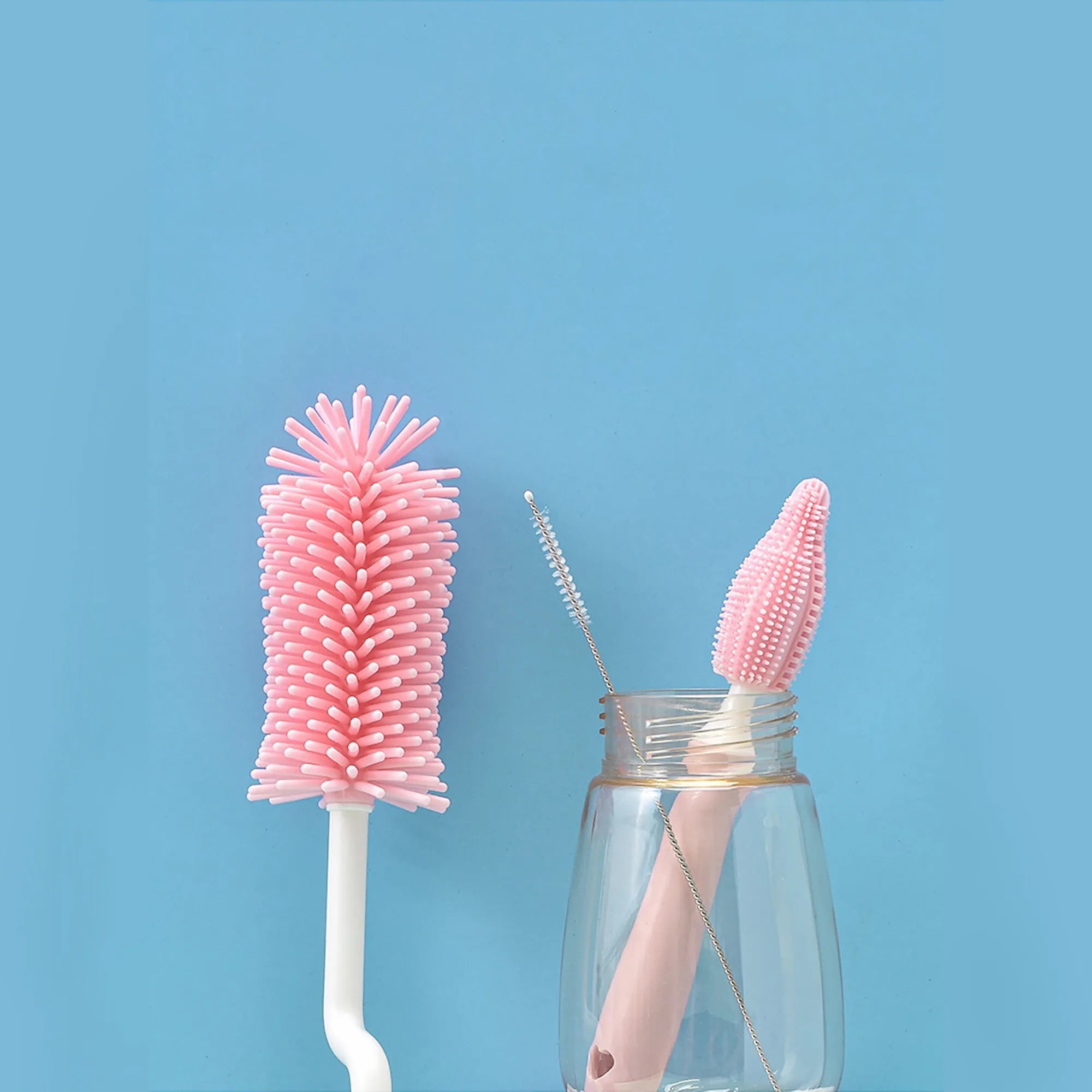 Silicone baby bottle brush set in pink blue and yellow colours for cleaning bottles and straws