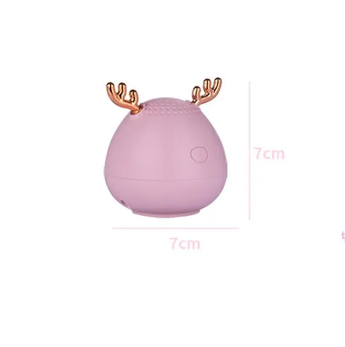 Compact Bluetooth wireless speaker in green colour with USB charging cable
