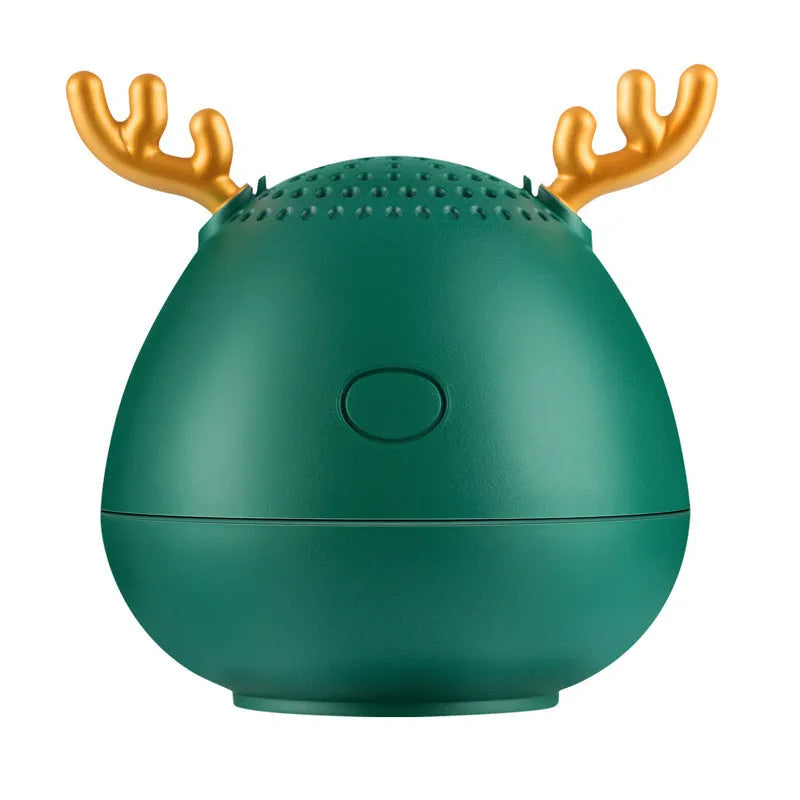 Compact Bluetooth wireless speaker in green colour with USB charging cable