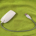 Flexible black USB gooseneck desk lamp with LED light bent into position