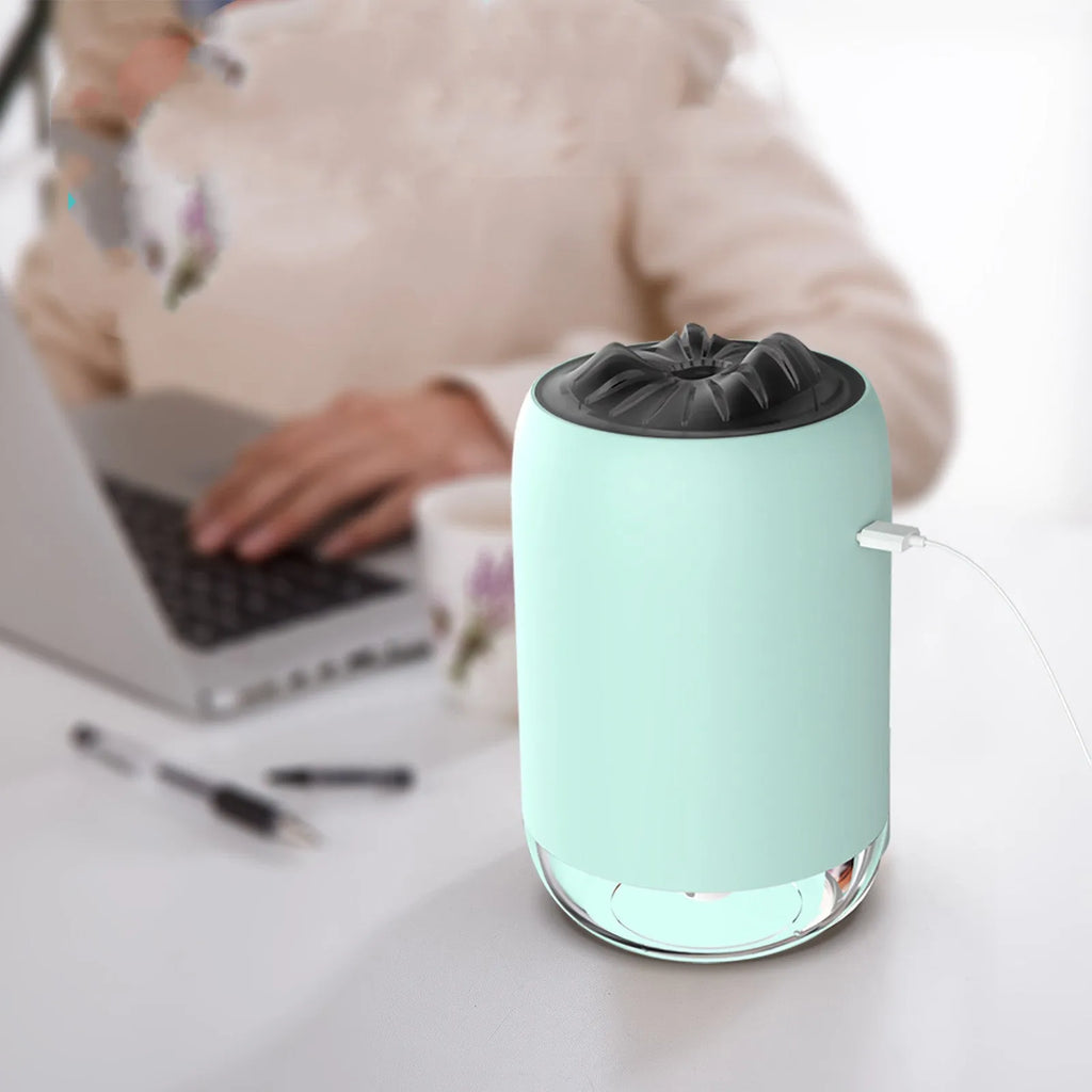 White Magic Flame ultrasonic humidifier and aroma diffuser on a wooden desk.