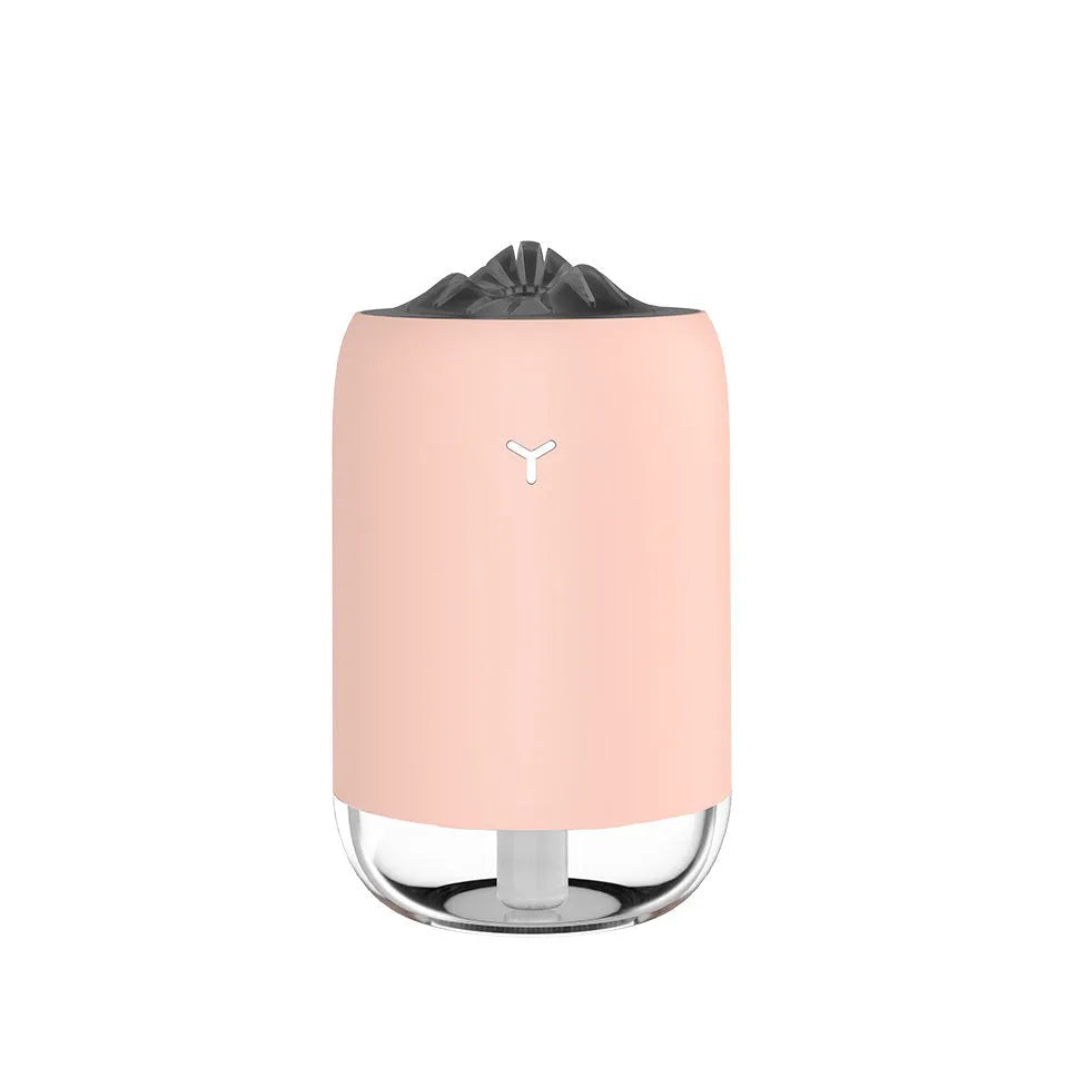 White Magic Flame ultrasonic humidifier and aroma diffuser on a wooden desk.
