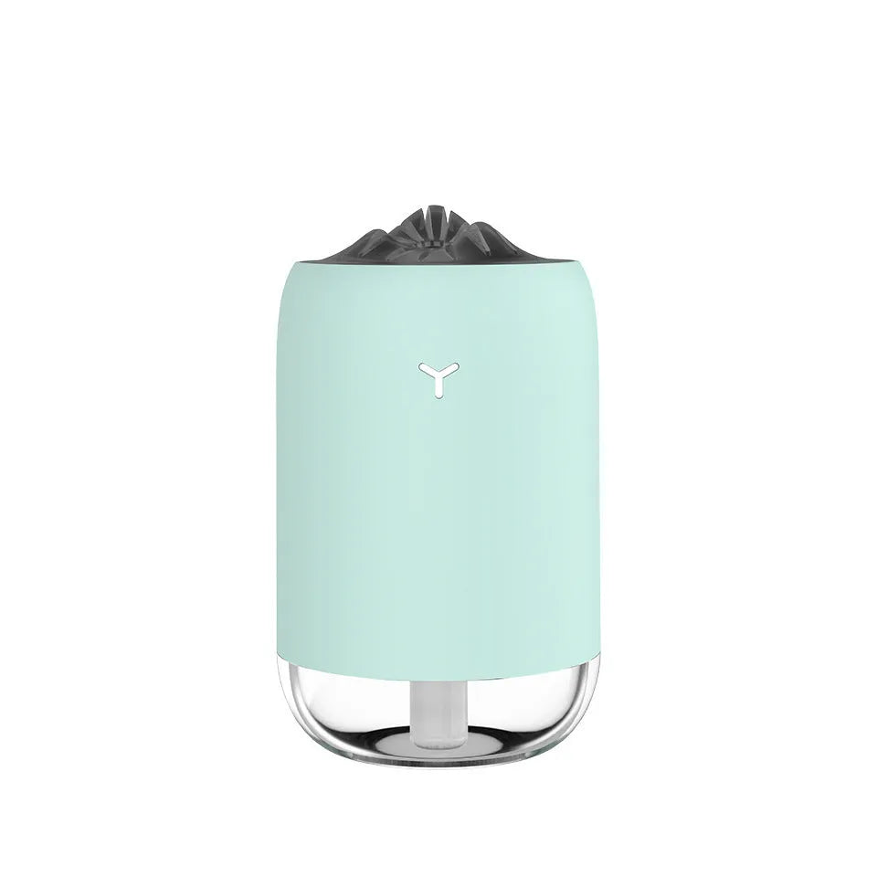 White Magic Flame ultrasonic humidifier and aroma diffuser on a wooden desk.