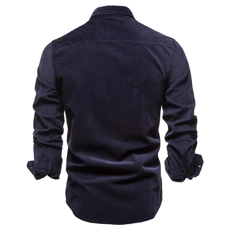 Men's denim blue long sleeve linen button-up shirt laid flat, showing button front and casual style.