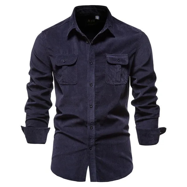 Men's denim blue long sleeve linen button-up shirt laid flat, showing button front and casual style.