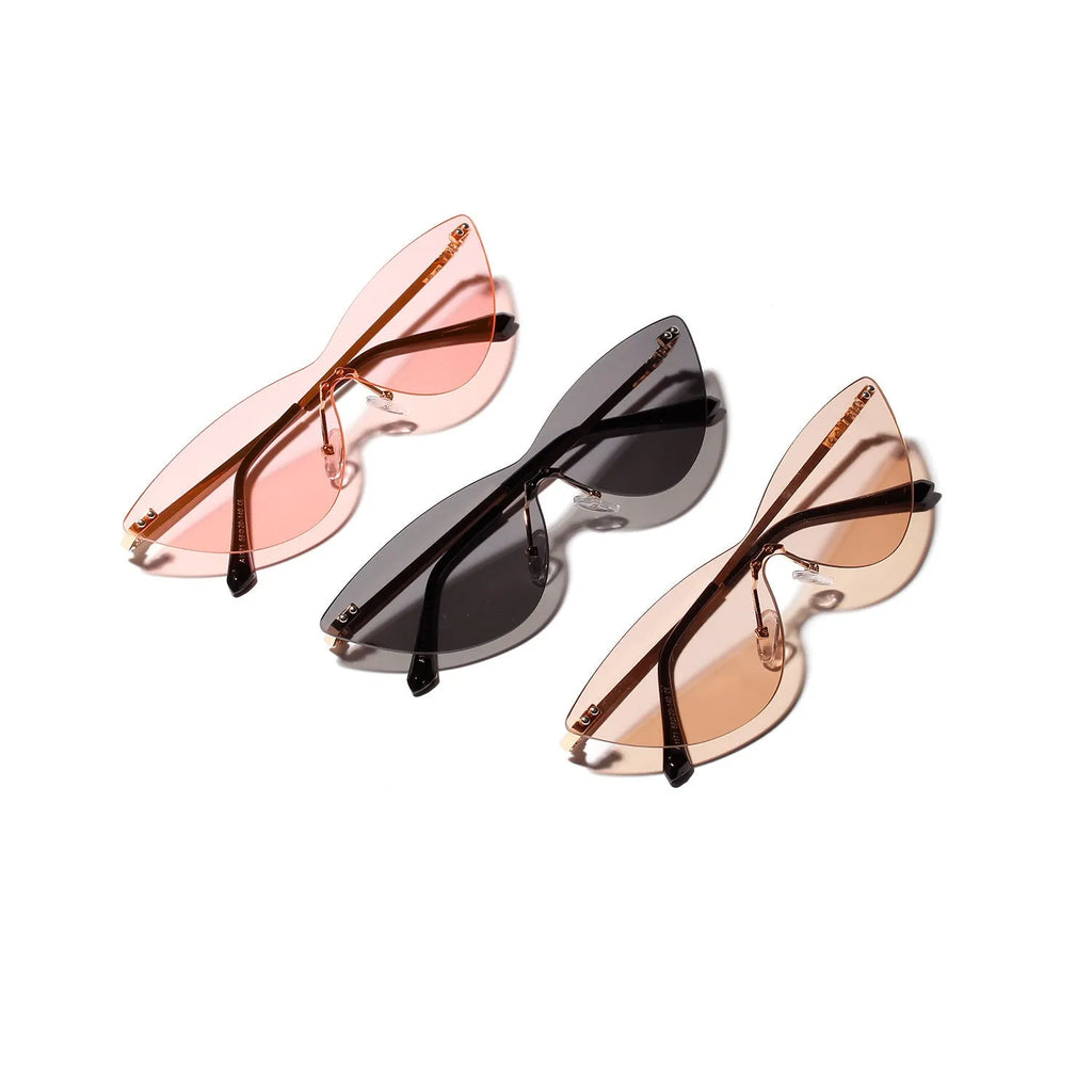 Brown vintage-style sunglasses with metal frame and tinted lenses.
