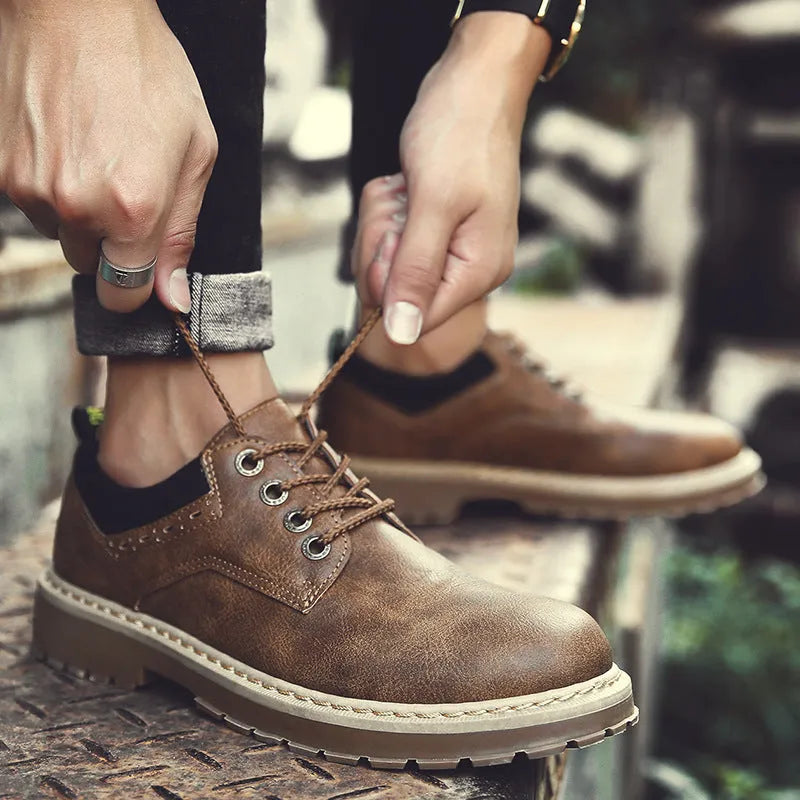 Men's black casual shoes with round toe, flat heel, and front lace-up closure.