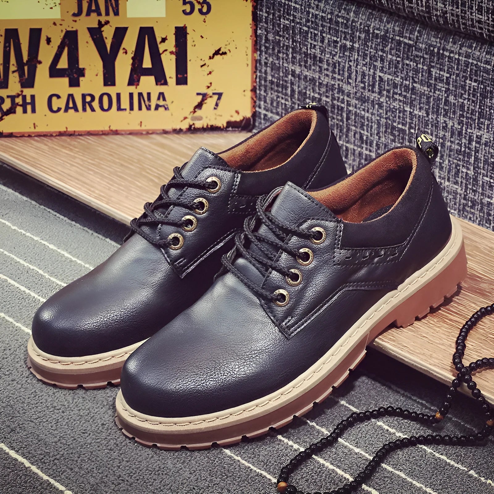 Men's black casual shoes with round toe, flat heel, and front lace-up closure.