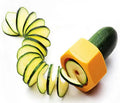 Yellow and green kitchen vegetable cutter with spiral knife mechanism for slicing cucumbers