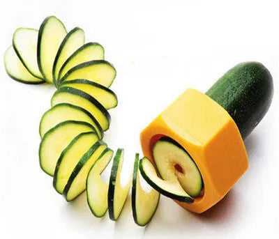 Yellow and green kitchen vegetable cutter with spiral knife mechanism for slicing cucumbers