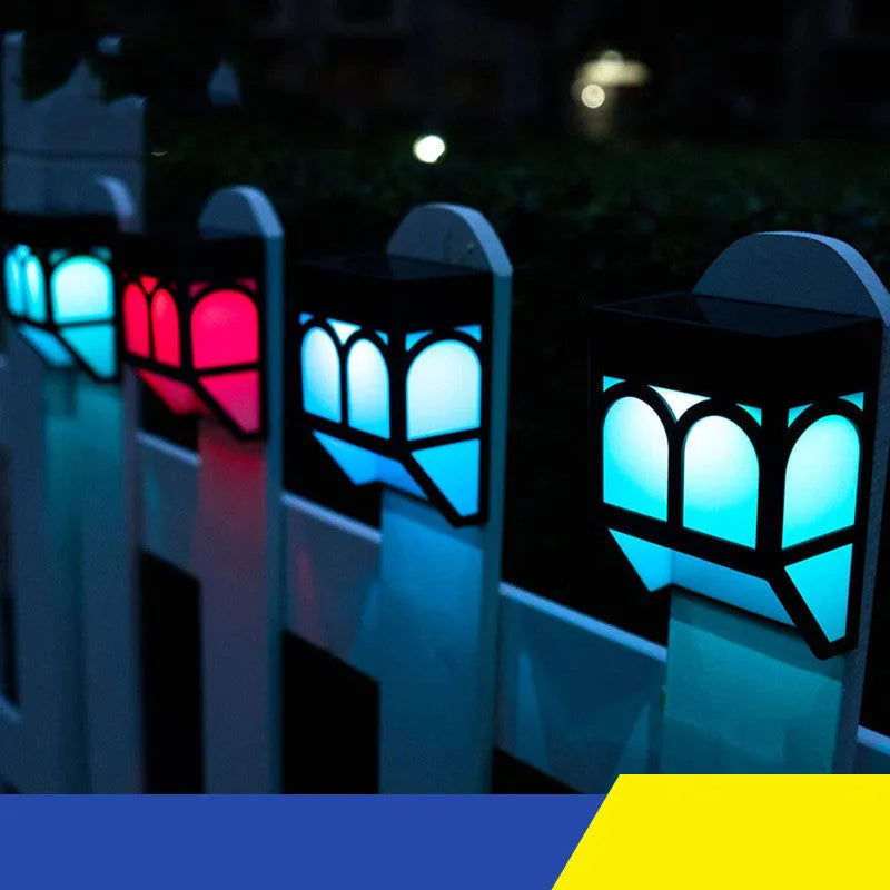 Solar-powered outdoor wall lamp with IP67 waterproof rating mounted on garden fence