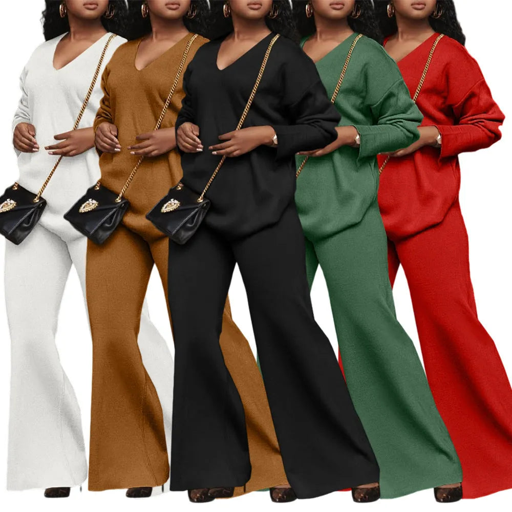 Women's brown suede two-piece suit with split sleeve detail on the long-sleeved top and matching trousers.