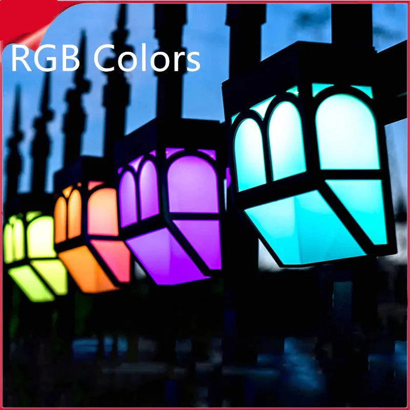 Solar-powered outdoor wall lamp with IP67 waterproof rating mounted on garden fence