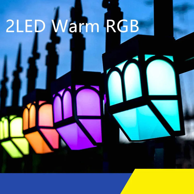 Solar-powered outdoor wall lamp with IP67 waterproof rating mounted on garden fence