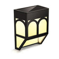 Solar-powered outdoor wall lamp with IP67 waterproof rating mounted on garden fence