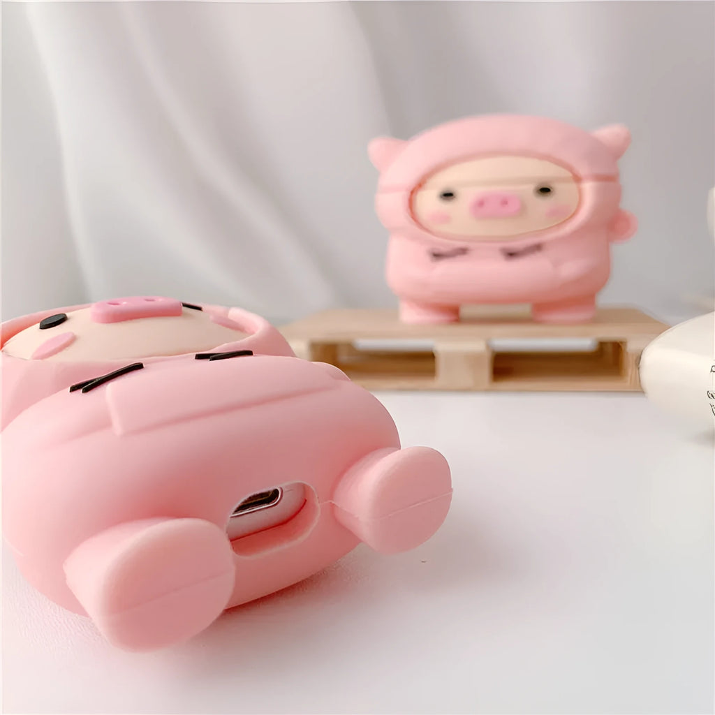 Pink silicone AirPods case with cartoon pig design and textured sweater finish