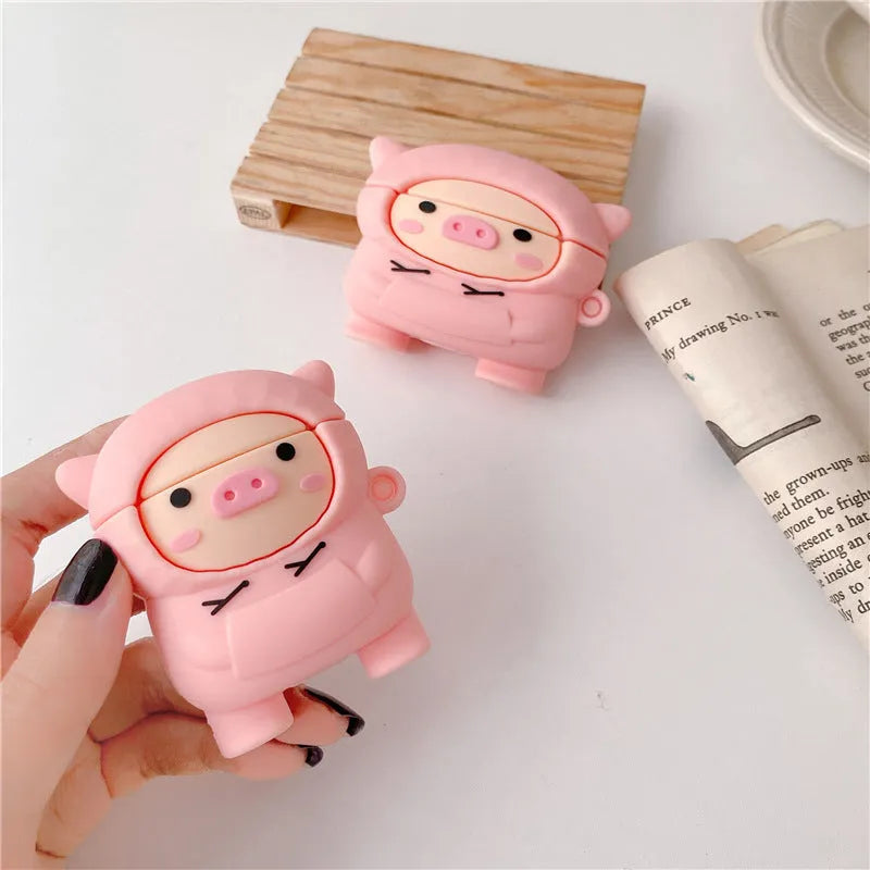 Pink silicone AirPods case with cartoon pig design and textured sweater finish